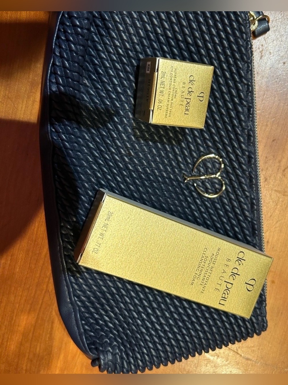 Clé de Peau Beauté  with Navy Pouch,  golden eye cream, softening cleansing